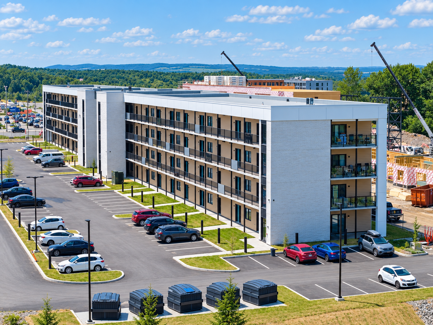 Cinq conteneurs CUBE semi-enfouis 8 v Ecoloxia installes pour un projet multilogement de 82 logements a Sherbrooke, Quebec